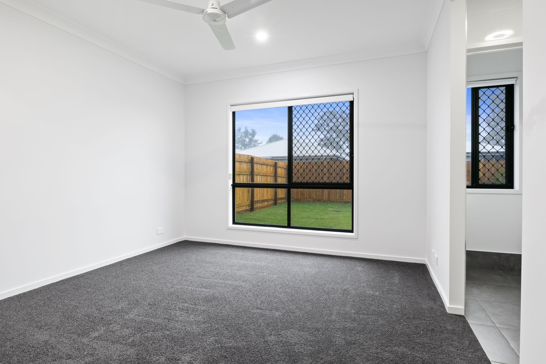 Modern renovated interior showcasing flawless stretch ceiling plane